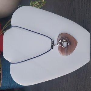 Agate stonecheart with sterling silver pendant with blue leather cord necklace.